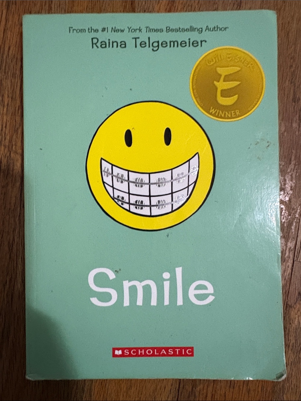 Scholastic Smile Paperback Mint Green Cover with Yellow Smiley